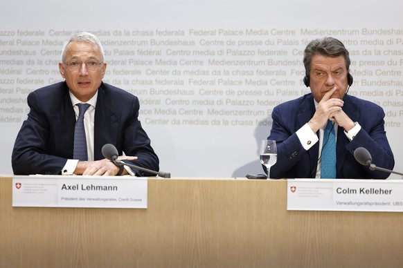 epa10532707 Axel Lehmann (L), Chairman Credit Suisse, speaks alongside Colm Kelleher (R), Chairman UBS, at a press conference in Bern, Switzerland, March 19, 2023. The bank UBS takes Credit Suisse ...