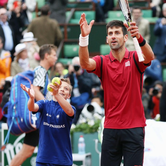 IMAGO / Kyodo News

Djokovic advances to French Open semis for sixth straight year Novak Djokovic (R) of Serbia celebrates with a ball boy after defeating Tomas Berdych of Czech Republic 6-3, 7-5, 6-3 ...