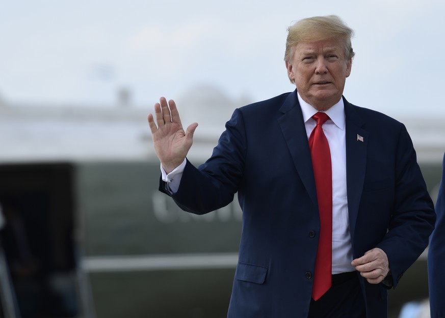 President Donald Trump waves before walking up the steps of Air Force One at Andrews Air Force Base in Md., Monday, June 25, 2018. Trump is traveling to West Columbia, S.C., to campaign for Republican ...