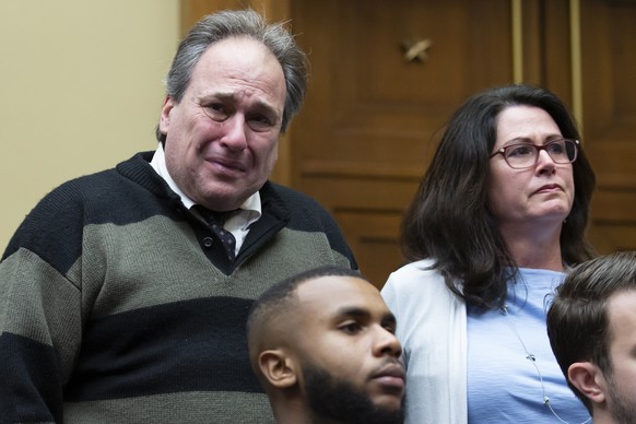 epa10538957 Dean (L) and Michelle Nasca (R), parents of the late Chase Nasca, a 16-year-old boy who died after apparently committing suicide, rise and are recognized during the testimony of TikTok CEO Sh…