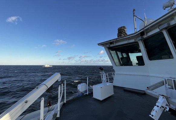 epa11741858 A handout photo made available by the Finnish Border Guard shows the boat of the Finnish guard ship Turvan on duty in the damaged area of ??the C-Lion-1 cable in the southern Baltic Sea, 2 ...