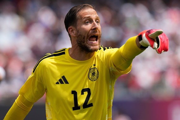 Germany goalkeeper Oliver Baumann directs his teammates during the first half of an international friendly soccer match against the United States in Chicago, Saturday, June 6, 2026. (AP Photo/Nam Y. H ...