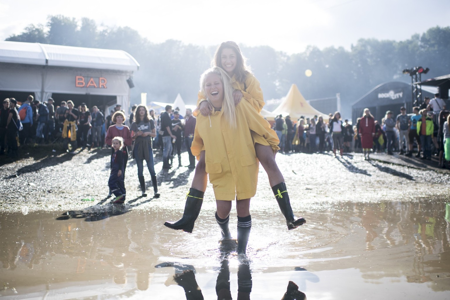 Festival visitors jumps in the mud during the music festival Openair St. Gallen, on Friday, June 30, 2017. The festival will take place until Sunday, July 2, 2017. (KEYSTONE/Ennio Leanza)
