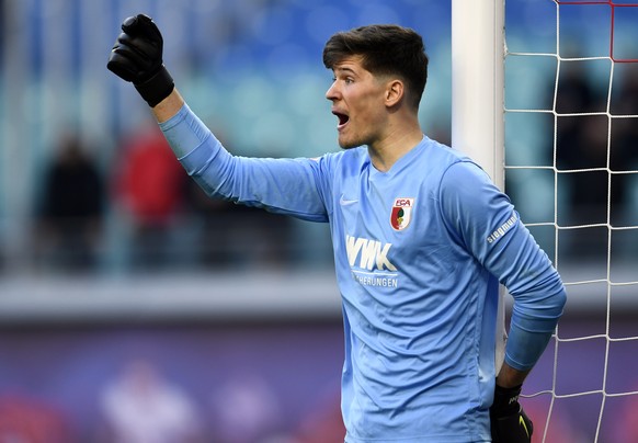 epa07424876 Augsburg&#039;s goalkeeper Gregor Kobel gestures during the German Bundesliga soccer match between RB Leipzig and FC Augsburg, in Leipzig, Germany, 09 March 2019. EPA/FILIP SINGER CONDITIO ...