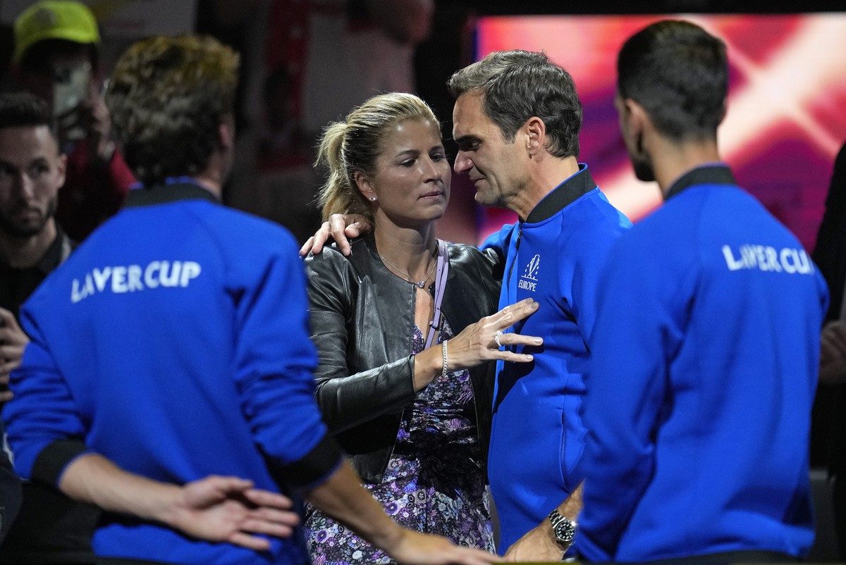 An emotional Roger Federer of Team Europe is embraced by his wife Mirka after playing with Rafael Nadal in a Laver Cup doubles match against Team World's Jack Sock and Frances Tiafoe at the O2 ar ...