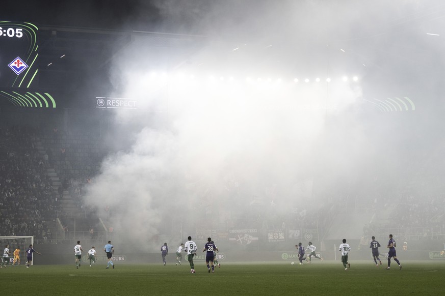 View of the stadium after fans of Fiorentina used pyrotechnics during the Europa Conference League opening phase soccer match between FC St. Gallen and Fiorentina, at the Kybunpark stadium in St. Gall ...