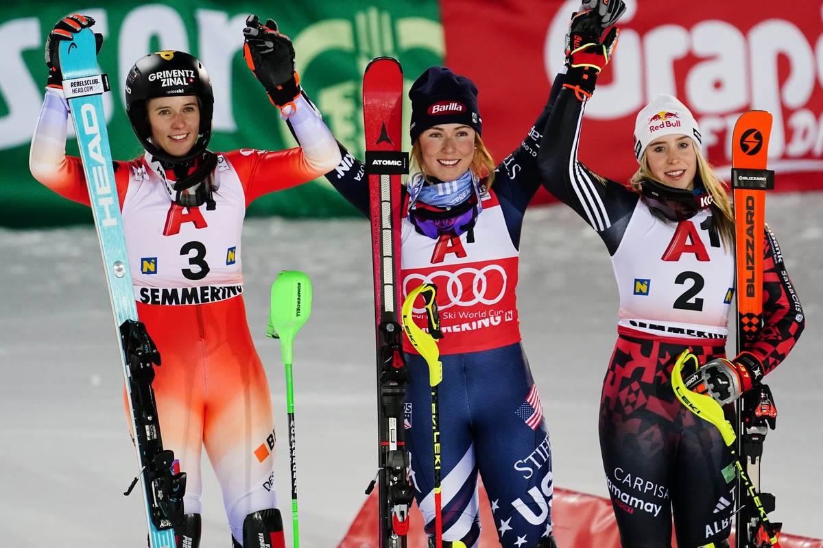 United States' Mikaela Shiffrin, center, winner of an alpine ski, women's World Cup slalom, poses with second placed Switzerland's Camille Rast, left, and third placed Albania's La ...