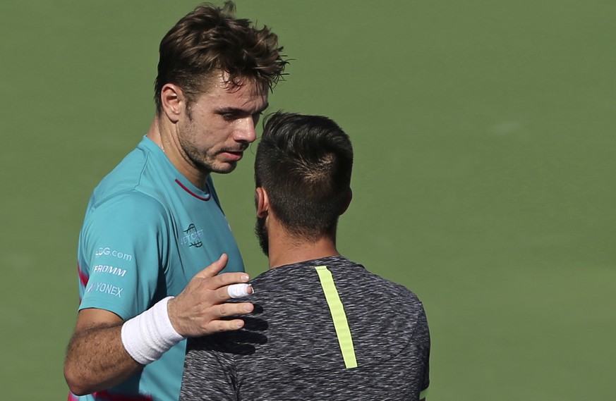 Stan Wawrinka of Switzerland congratulates Damir Dzumhur of Bosnia-Herzegovina after he was beaten by him during the Dubai Tennis Championships, in Dubai, United Arab Emirates, Tuesday, Feb. 28, 2017. ...