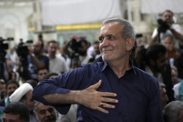 Iran&#039;s President-elect Masoud Pezeshkian greets his supporters in a meeting a day after the presidential election, at the shrine of the late revolutionary founder Ayatollah Khomeini, just outside ...