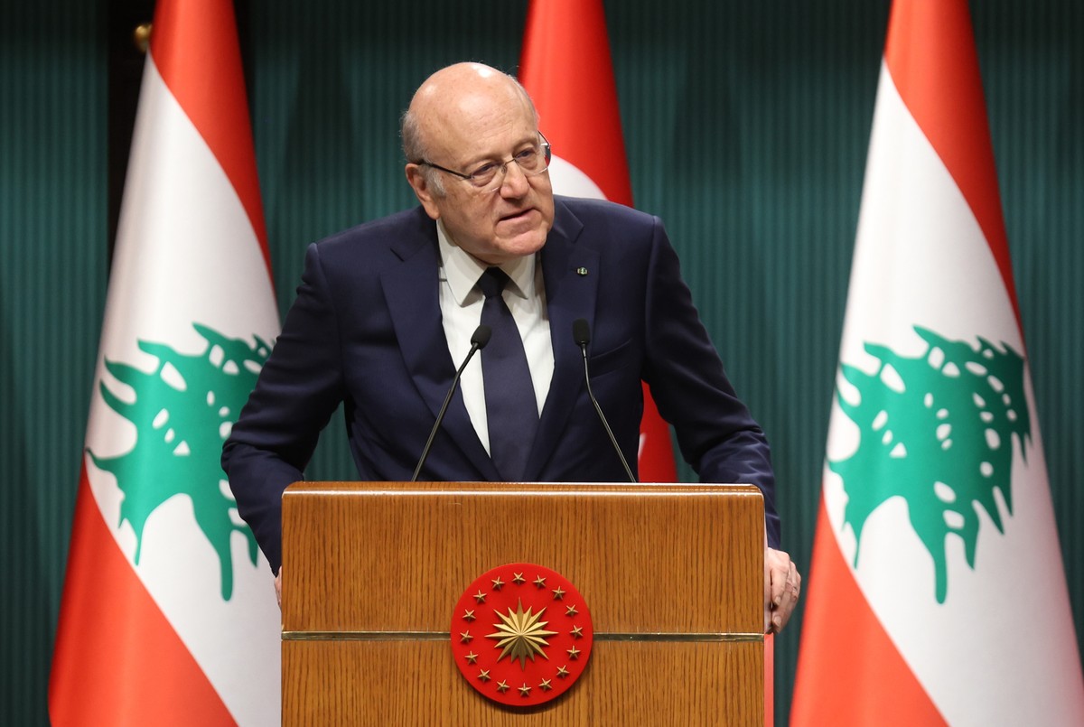 epa11784249 Lebanese Prime Minister Najib Mikati speaks during a press conference with Turkish President Recep Tayyip Erdogan, after their meeting at the Presidential Palace in Ankara, Turkey, 18 Dece ...