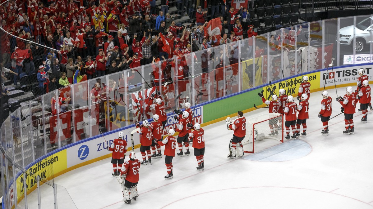 Switzerland's players cheer Switzerland's supporters after beating Austria team, during the IIHF 2018 World Championship preliminary round game between Switzerland and Austria, at the Royal  ...