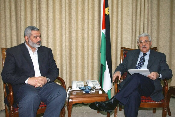 The Hamas Leader Behind The Deadliest Ever Attack On Israel File photo - Palestinian president Mahmoud Abbas receives Hamas leader Ismail Haniyeh L and officially asks him to form a new government in  ...