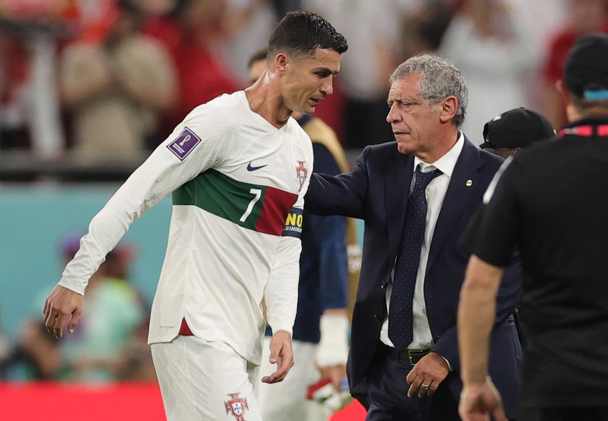 epaselect epa10359623 Cristiano Ronaldo of Portugal reacts Head coach Fernando Santos of Portugal (R) after the FIFA World Cup 2022 quarter final soccer match between Morocco and Portugal at Al Thumam ...