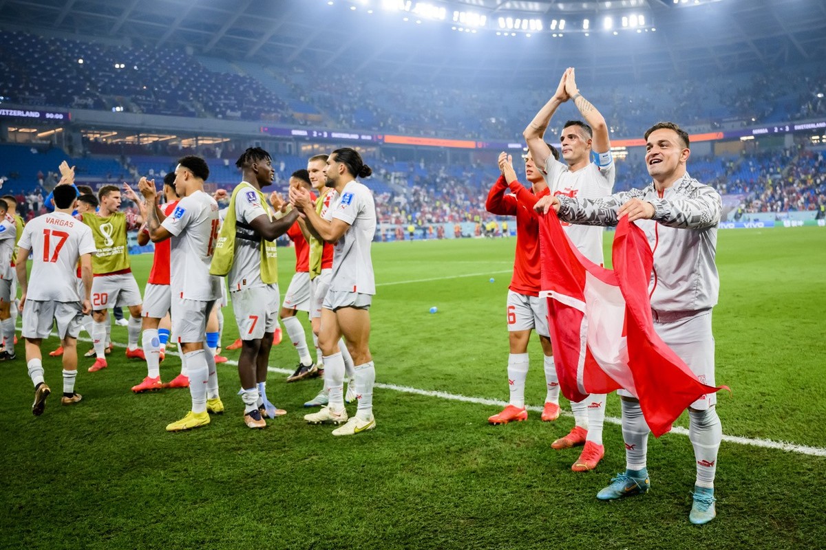 Switzerland's soccer players with Switzerland's midfielder Granit Xhaka and Switzerland's midfielder Xherdan Shaqiri, right, celebrate the victory and the qualification during the FIFA  ...