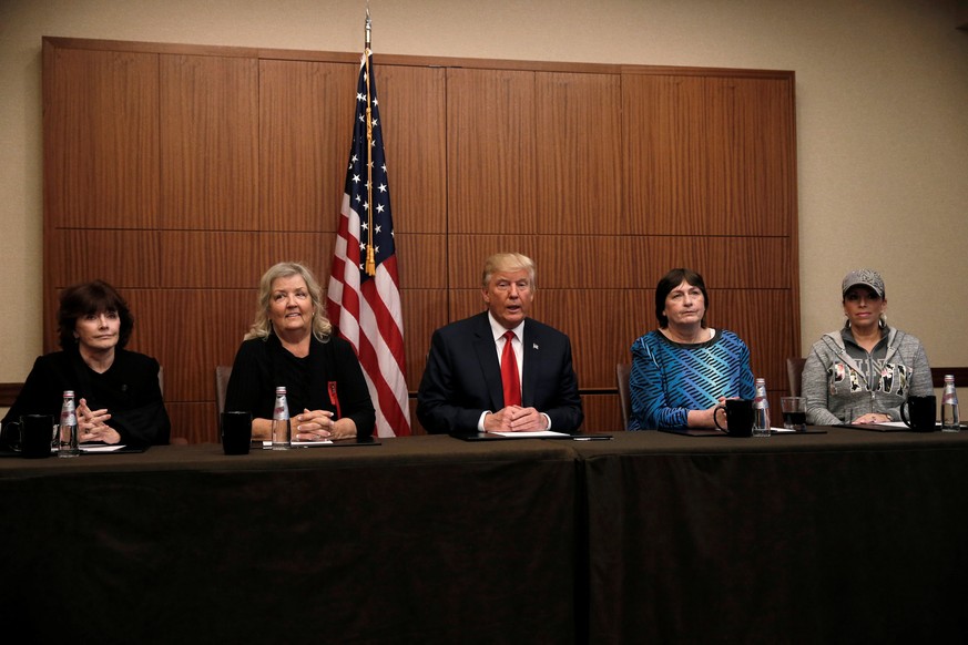 Republican presidential nominee Donald Trump sits with (from R-L) Paula Jones, Kathy Shelton, Juanita Broaddrick, Kathleen Willey in a hotel conference room in St. Louis, Missouri, U.S., shortly befor ...