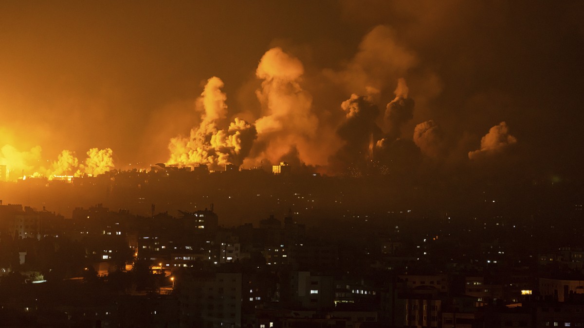 Fire and smoke rise following an Israeli airstrike, in Gaza City, Sunday, Oct. 8, 2023. The militant Hamas rulers of the Gaza Strip carried out an unprecedented, multi-front attack on Israel at daybre ...
