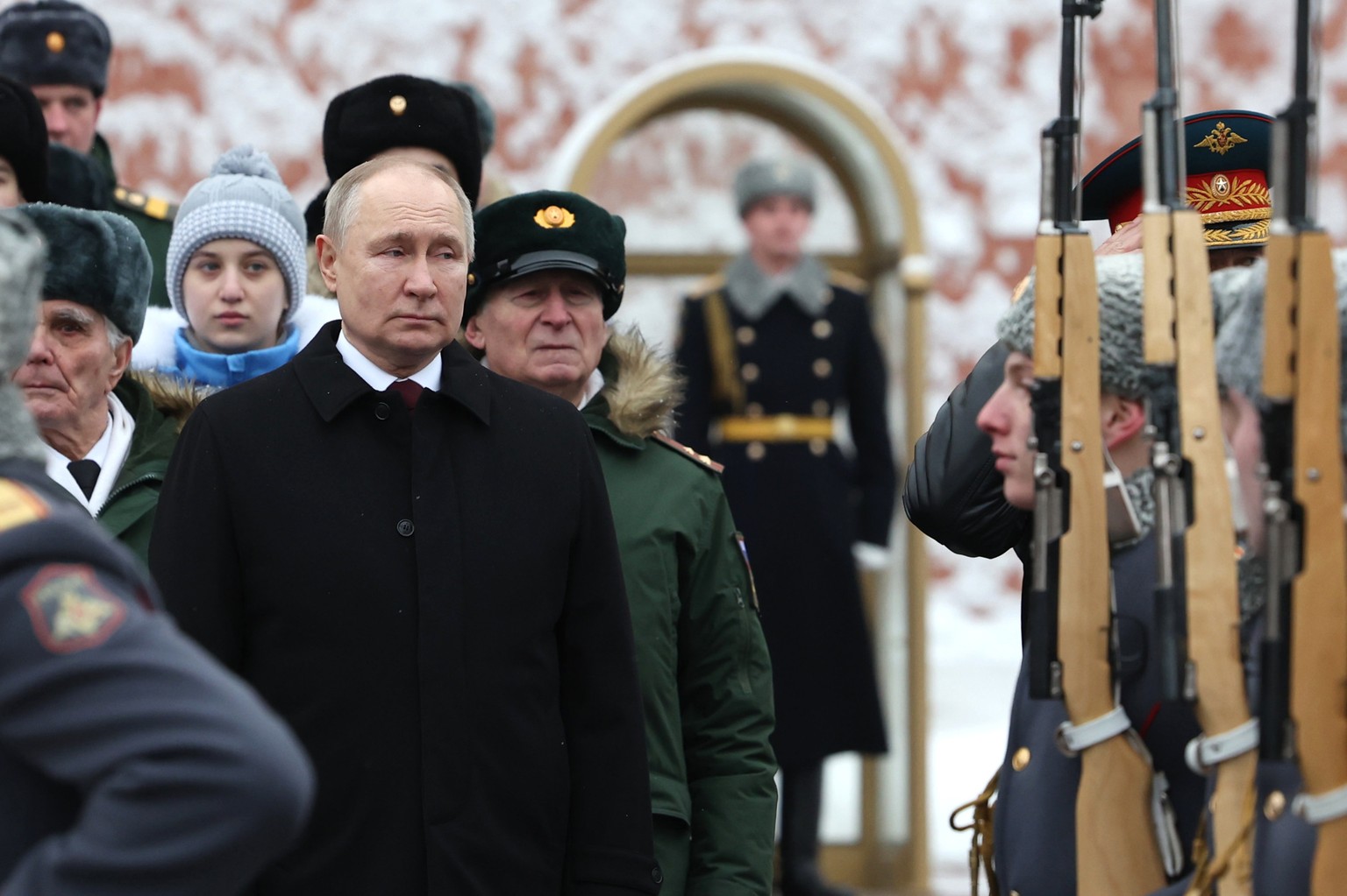 Russian President Vladimir Putin takes part in a wreath laying ceremony at the Tomb of the Unknown Soldier in Alexander Garden on Defender of the Fatherland Day, in Moscow, Russia, Friday, Feb. 23, 20 ...