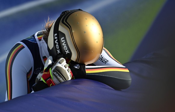 epa12715750 Emma Aicher of Germany reacts in the finish area during the Women's Downhill of the Alpine Skiing competition, at the Milano Cortina 2026 Winter Olympic, Tofane ski centre in Cortina  ...