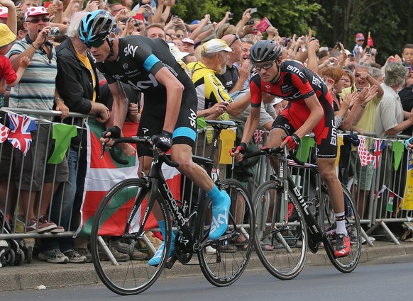 SHEFFIELD, ENGLAND - JULY 06: Chris Froome (L) of Great Britain and Team Sky leads the race as he attacks on the final climb and claims the points at the top of the Cote de Jenkins Road during stage t ...