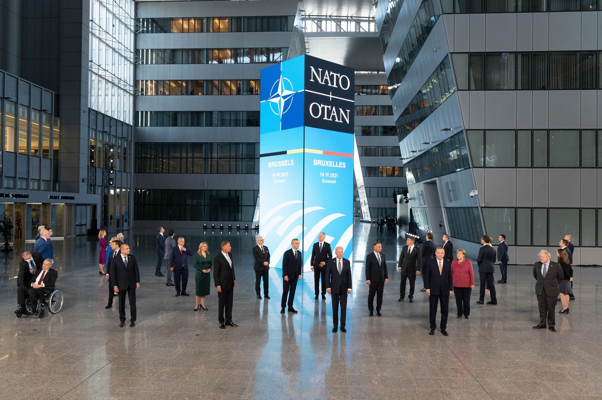 Leaders pose for a family picture at the NATO headquarters where the 30-nation alliance hopes to reaffirm its unity and discuss increasingly tense relations with China and Russia, as the organization  ...