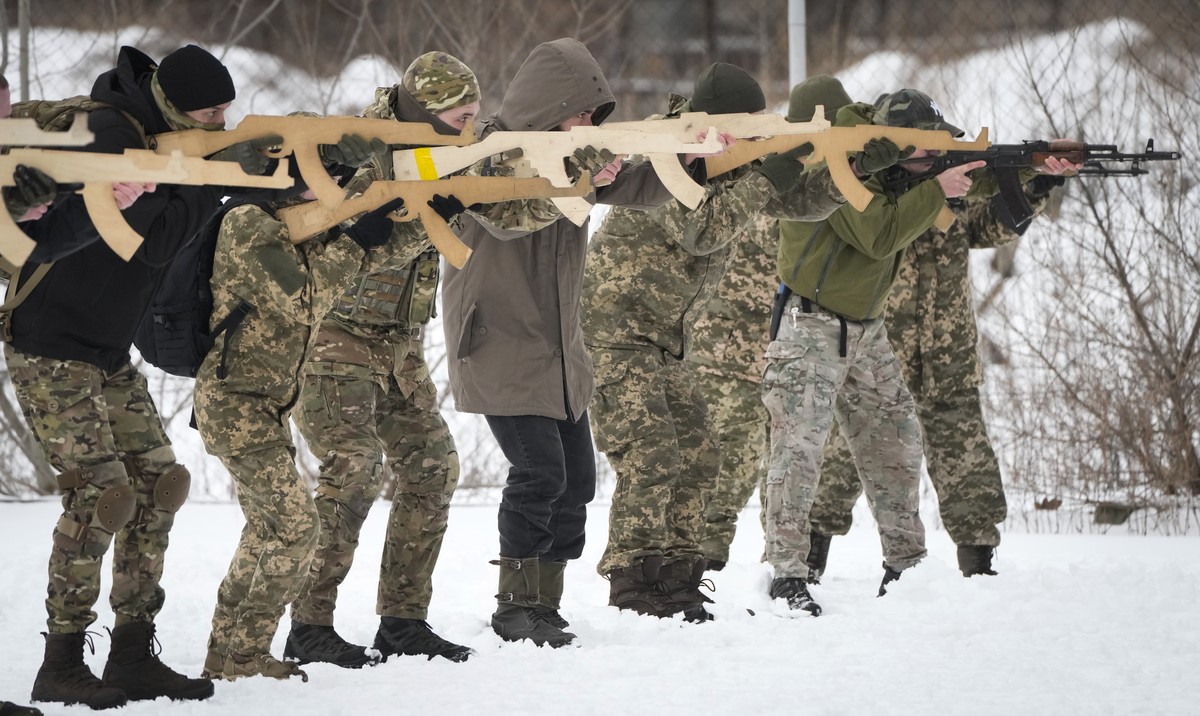 Local residents train close to Kyiv, Ukraine, Sunday, Jan. 30, 2022. Russia's foreign minister claims that NATO wants to pull Ukraine into the alliance, amid escalating tensions over NATO expansi ...