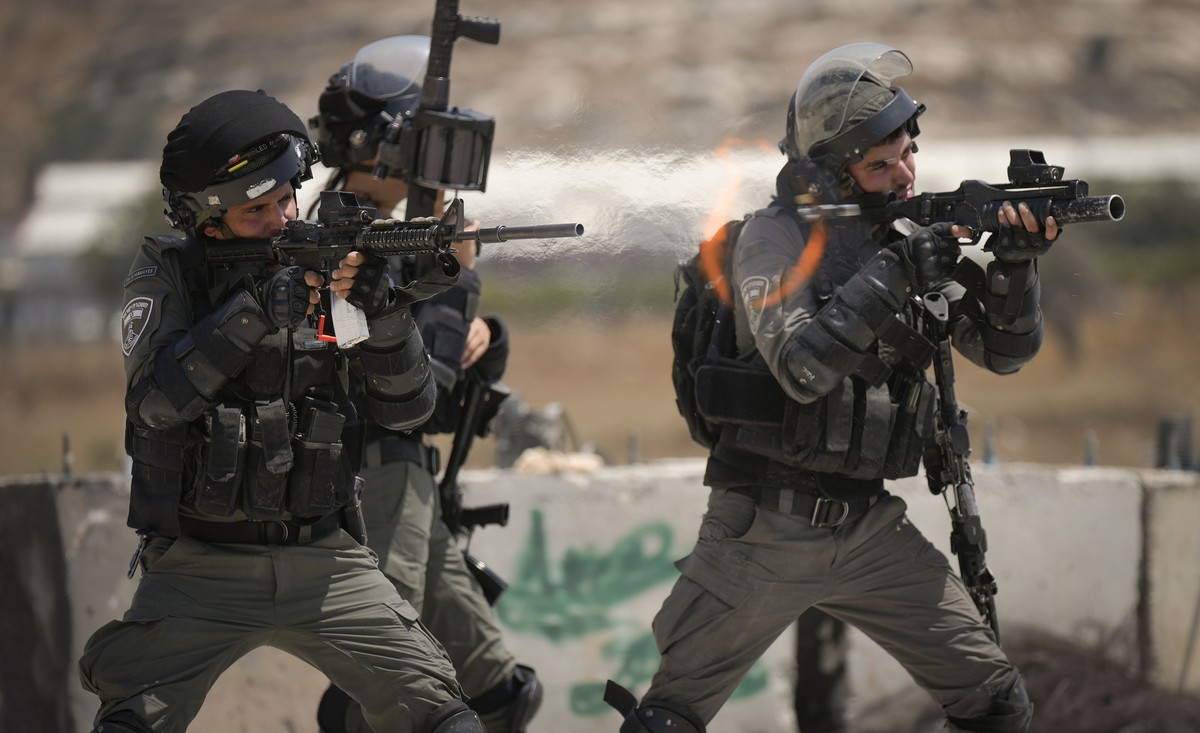 Israeli security forces fires rubber coated bullets during clashes with Palestinians following a demonstration against Israel's airstrikes on Gaza Strip, near the West Bank Jewish settlement of B ...