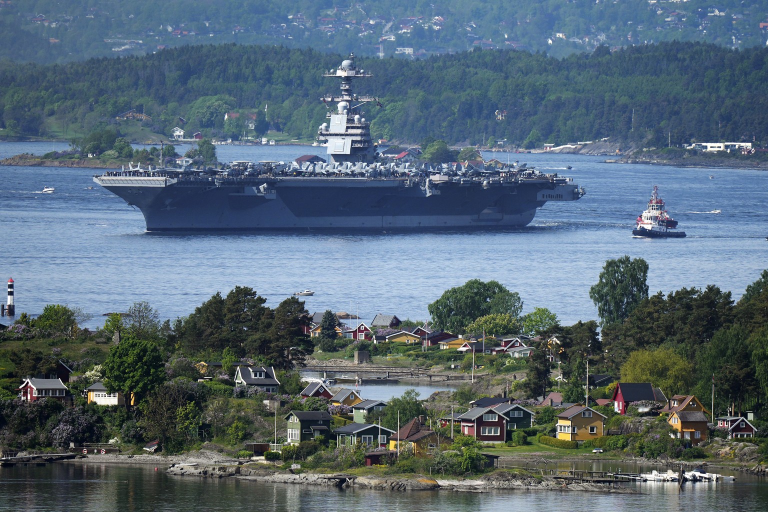 The American aircraft carrier USS Gerald R. Ford drives in the Oslo Fjord, Norway, here seen from Ekebergskrenten, Wednesday, May 24, 2023. The ship is the world&#039;s largest warship and will be in  ...