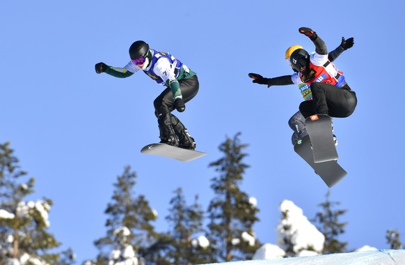 Belle Brockhoff of Australia, left, in the air ahead of competition to win the FIS Mixed Snowboard Cross Team World Championships event in Idre, Sweden, Friday Feb. 12, 2021. (Anders Wiklund / TT via  ...