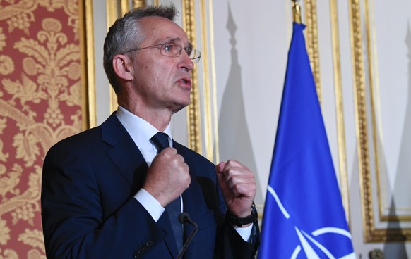 NATO Secretary General Jens Stoltenberg, left, attends media conference with French Foreign Minister Jean-Yves Le Drian and French Defence Minister Florence Parly in Paris, Friday, Dec. 10, 2021. (Ber ...