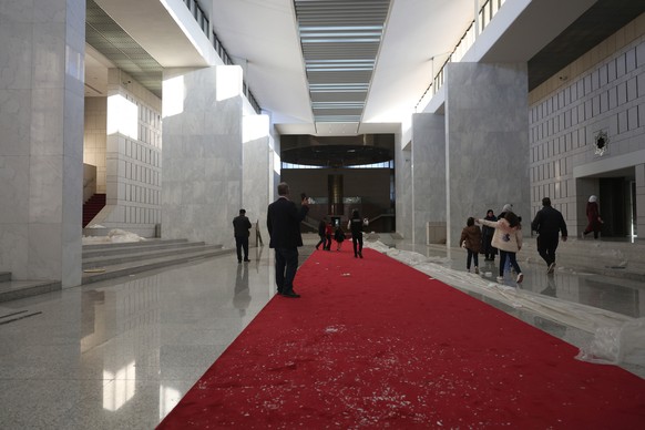 epa11765328 People inside the presidential palace after Syrian rebels took over Damascus, Syria, 08 December 2024. Syrian rebels entered Damascus on 08 December 2024 and announced in a televised state ...