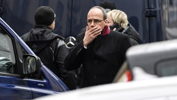 Hessen provinces interior minister Peter Beuth walks in front of the hookah bar where several people were killed on Wednesday in Hanau, Germany, Thursday, Feb. 20, 2020. A 43-year-old German man shot  ...