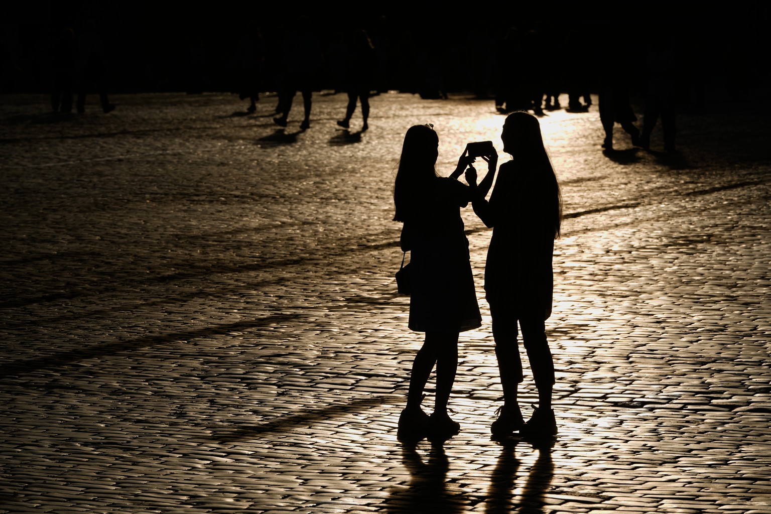 People walk through Red Square during sunset in Moscow, Monday, July 6, 2026. (AP Photo/Pavel Bednyakov)
Russia Daily Life