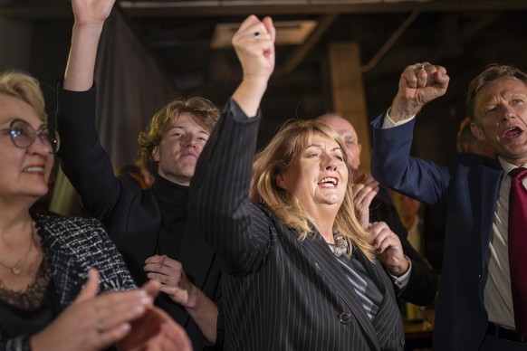 Leader of the Social Democratic Party Vilija Blinkeviciute, center, celebrates winning the first round of Lithuania&#039;s parliamentary election, in Vilnius, Lithuania, Sunday, Oct. 13, 2024. (AP Pho ...