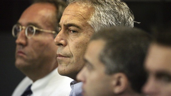FILE - In this July 30, 2008, file photo, Jeffrey Epstein appears in custody in West Palm Beach, Fla. A last-minute settlement has been reached in a long-running lawsuit involving a Epstein, a wealthy ...