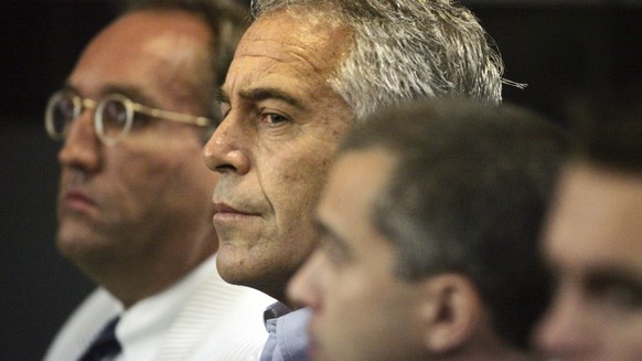 FILE - In this July 30, 2008 file photo, Jeffrey Epstein appears in custody in West Palm Beach, Florida.  A last-minute settlement has been reached in a long-running lawsuit involving Epstein, a wealthy...