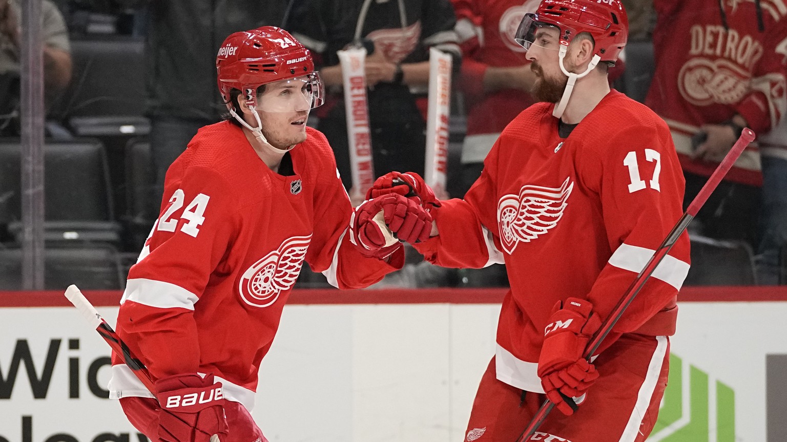 Detroit Red Wings center Pius Suter (24) celebrates his goal with Filip Hronek (17) against the San Jose Sharks in the second period of an NHL hockey game Tuesday, Jan. 4, 2022, in Detroit. (AP Photo/ ...