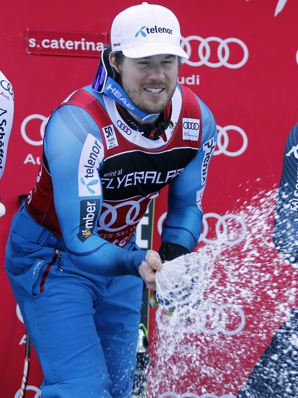 Norway&#039;s Kjetil Jansrud, center, winner of an alpine ski, men&#039;s World Cup Super G race, celebrates on the podium with second-placed Austria&#039;s Hannes Reichelt and third-placed Italy&#039 ...