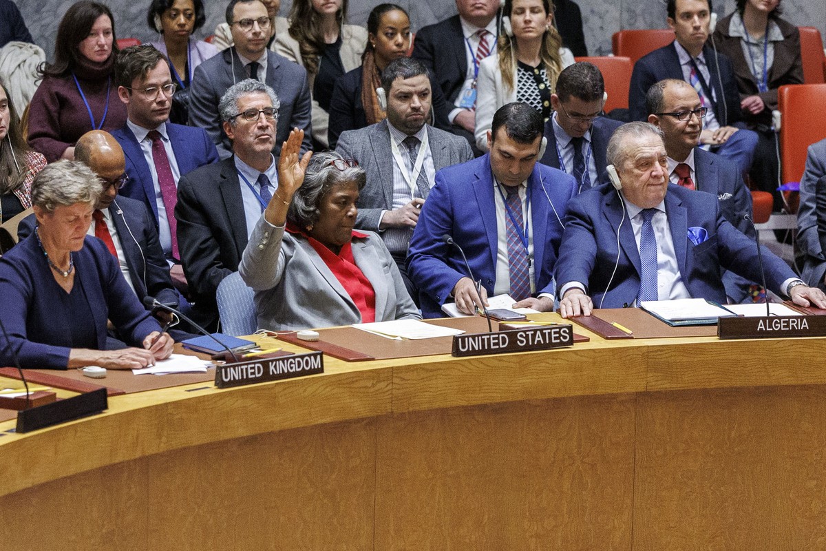 epa11242914 United States Ambassador Linda Thomas-Greenfield (C) raises her hand to abstain from a vote on a resolution calling for an immediate ceasefire in Gaza, during a United Nations Security Cou ...