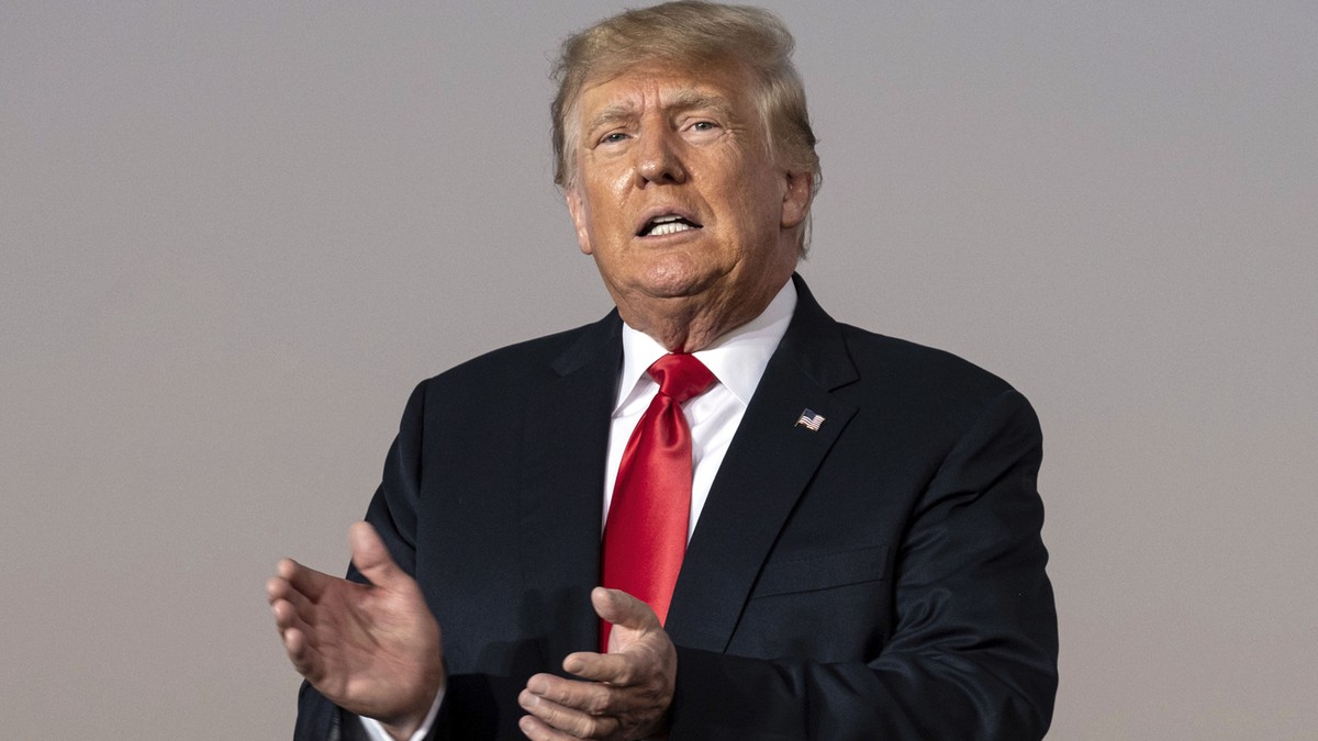 FILE - In this Sept. 25, 2021, file photo, former President Donald Trump prepares to take the stage during his Save America rally in Perry, Ga. Supporters of Republican Georgia Gov. Brian Kemp are fig ...