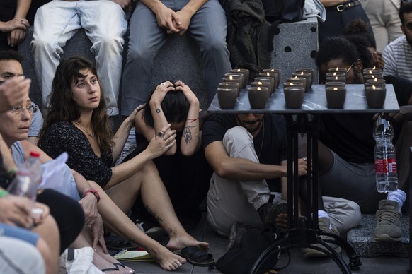 Mourners attend a funeral of Ziv Shapira, an Israeli who was killed by Hamas militants, outside a bar in Tel Aviv, Israel, Thursday, Oct. 19, 2023. (AP Photo/Petros Giannakouris)