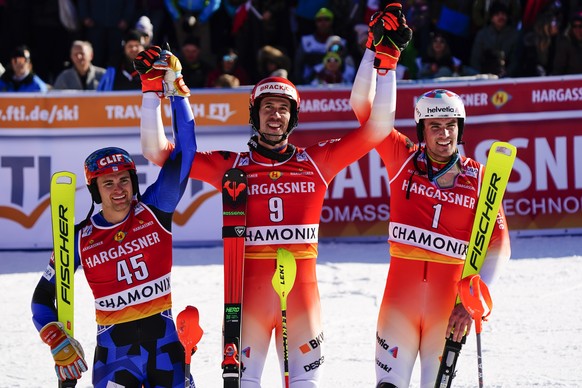 Switzerland&#039;s Ramon Zenhaeusern, center, winner of an alpine ski, men&#039;s World Cup slalom, celebrates with second-placed Greece&#039;s Aj Ginnis, left, and third-placed Switzerland&#039;s Dan ...