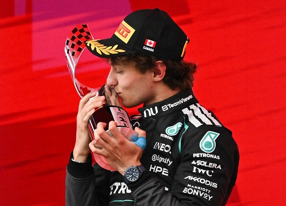 KEYPIX - Mercedes driver Kimi Antonelli, of Italy, kisses the trophy following his win in the F1 Canadian Grand Prix auto race in Montreal, Sunday, May 24, 2026. (Graham Hughes/The Canadian Press via  ...