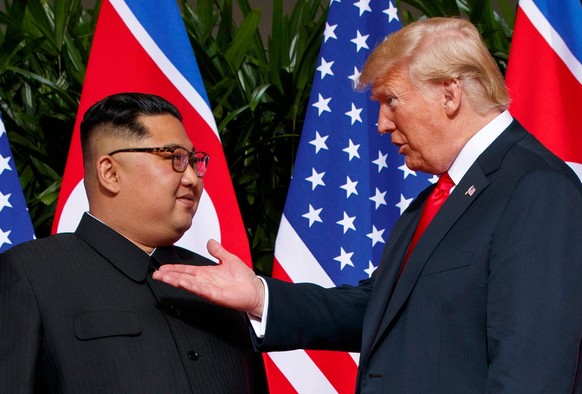 FILE - U.S. President Donald Trump, right, meets with North Korean leader Kim Jong Un on Sentosa Island in Singapore, on June 12, 2018. (AP Photo/Evan Vucci, File)
Donald Trump,Kim Jong Un