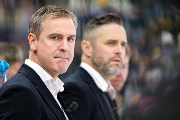 Head coach Dan Tangnes of EV Zug, left, looks on during the Champions Hockey League playoff quarterfinal second leg game between EV Zug and Mountfield Hradec Kralove at the Bossard Arena on December 1 ...