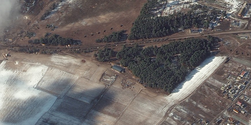 epa09816367 A handout satellite image made available by Maxar Technologies shows resupply trucks and probable multiple rocket launch deployment in Berestyanka, Ukraine, 10 March 2022. EPA/MAXAR TECHNO ...