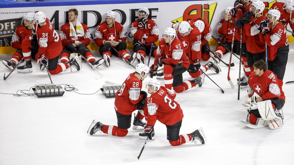 Switzerland's players look disappointed after losing against team Sweden, during the shootout of the IIHF 2018 World Championship Gold Medal game between Sweden and Switzerland, at the Royal Aren ...