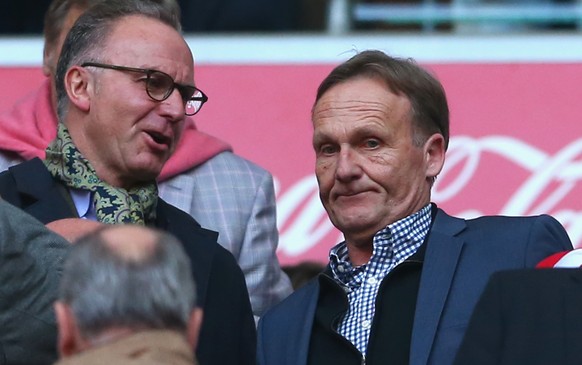 MUNICH, GERMANY - APRIL 12: Karl-Heinz Rummenigge (L) CEO of Bayern Muenchen talks to Hans-Joachim Watzke, CEO of Dortmund prior to the Bundesliga match between FC Bayern Muenchen and BVB Borussia Dor ...