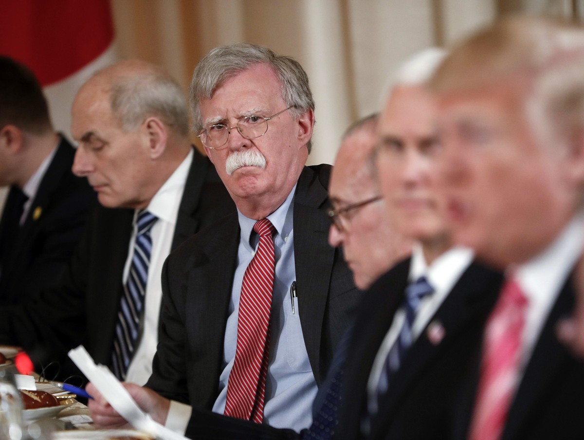 National security adviser John Bolton, second from the left, listen to President Donald Trump, far right, speak during a working lunch with Japanese Prime Minister Shinzo Abe at Trump' s private  ...