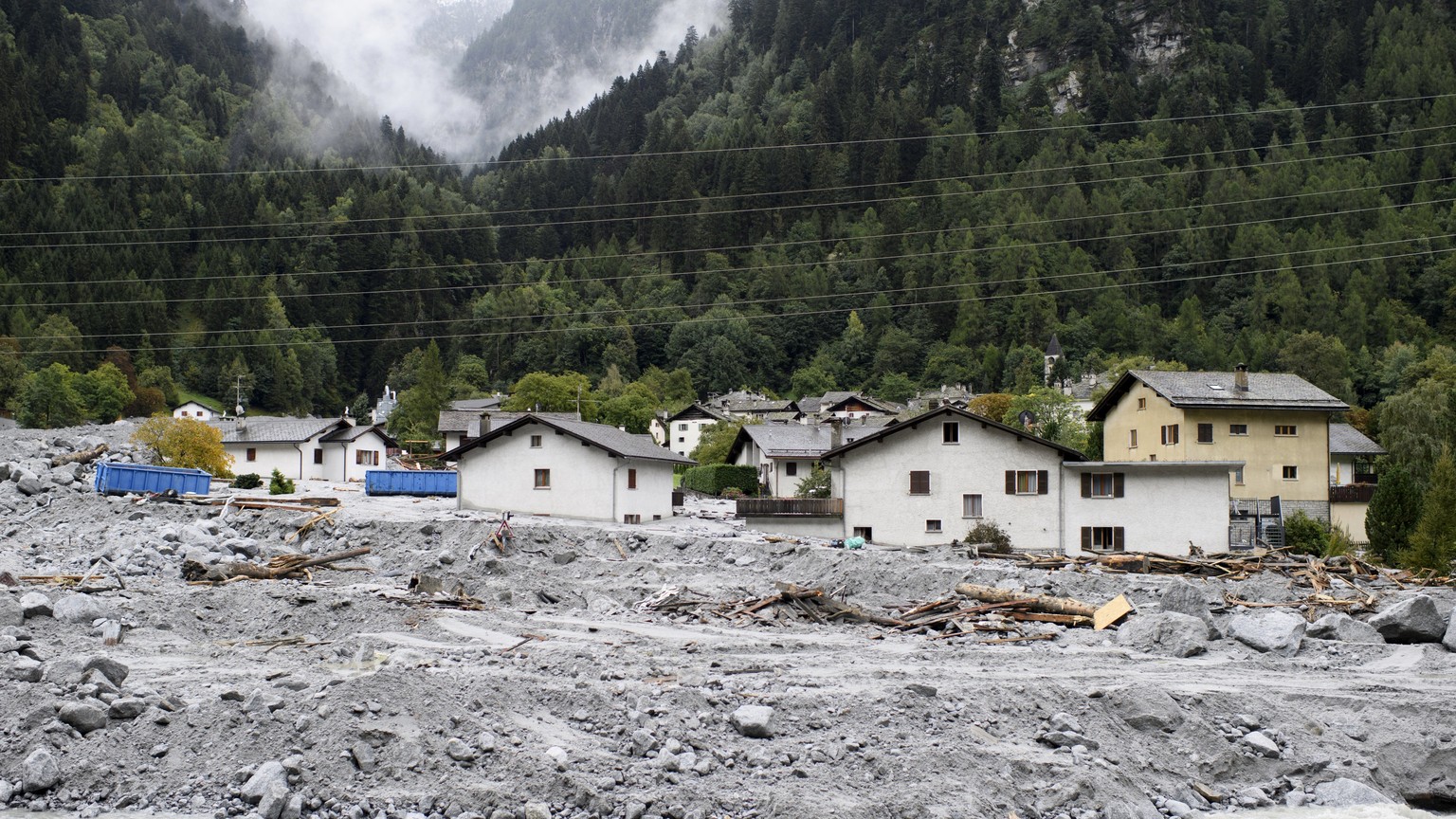 epa06195770 A general view over debris during a media tour in the evacuated village of Bondo, Switzerland, 10 September 2017. The village has been hit by a massive landslide on 23 August, eight people ...