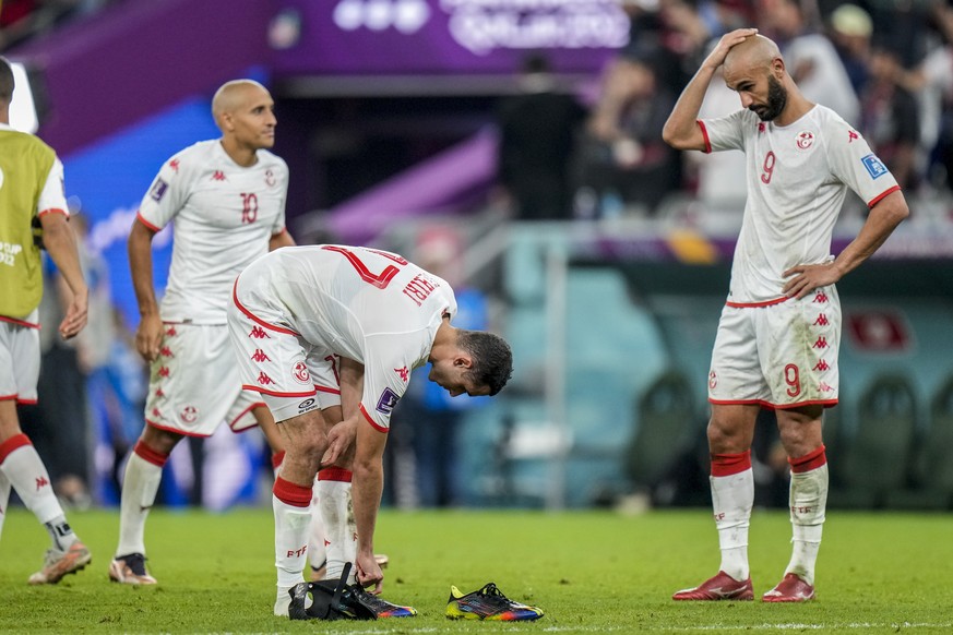 Tunisia&#039;s players react at the end of the World Cup group D soccer match between Tunisia and France at the Education City Stadium in Al Rayyan, Qatar, Wednesday, Nov. 30, 2022. (AP Photo/Alessand ...